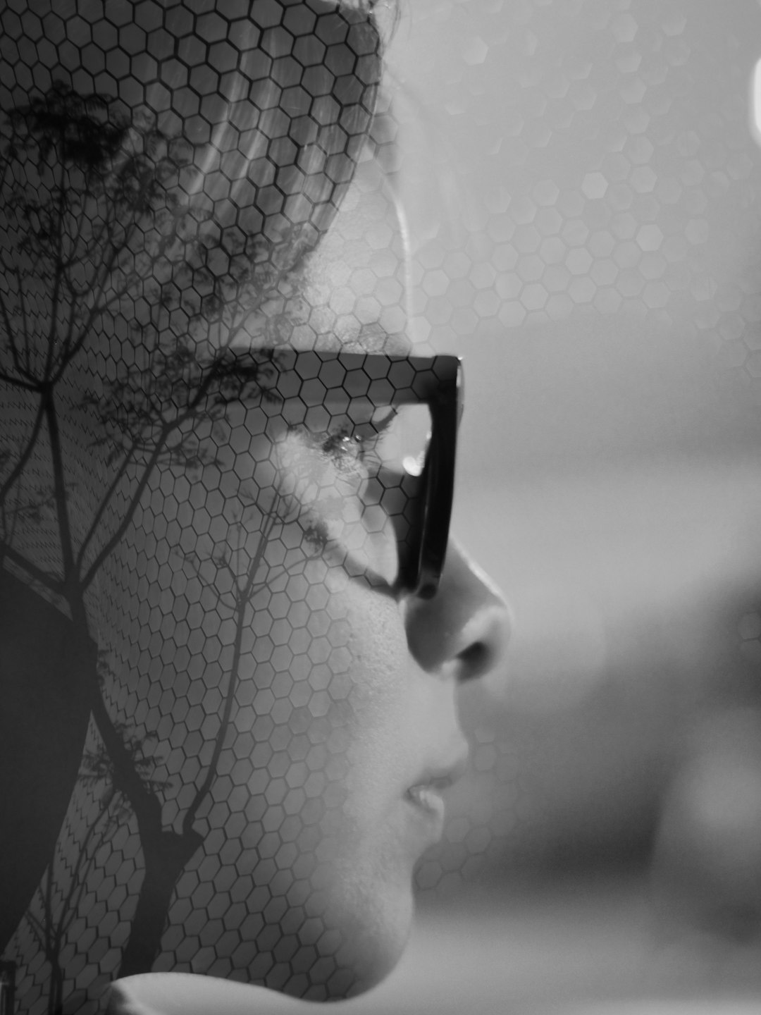 About double-exposure-of-a-womans-face-and-tree-branches-pz897k3lijs